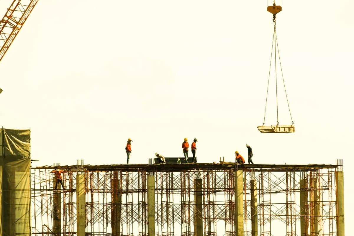 Builders on a high risk construction site.