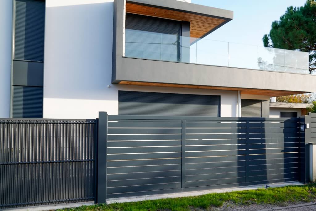 Modern, contemporary home with aluminium slat fencing front fence